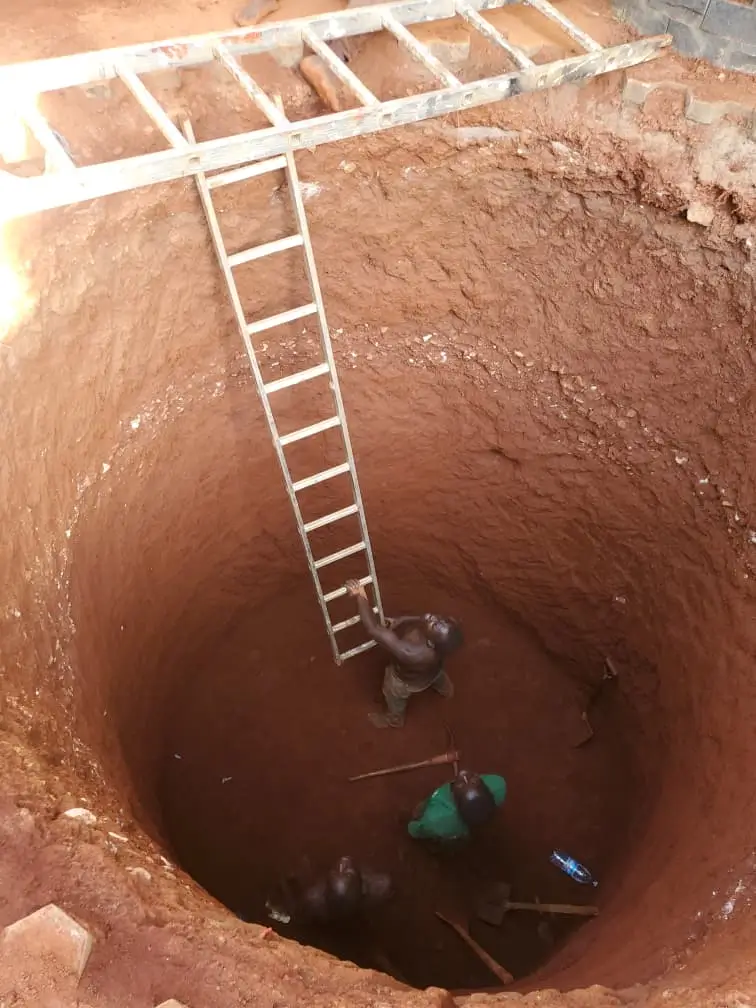 Emergency plumber fixing burst pipe in Kampala