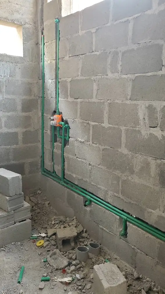 Pipe installation work by licensed plumber in Uganda